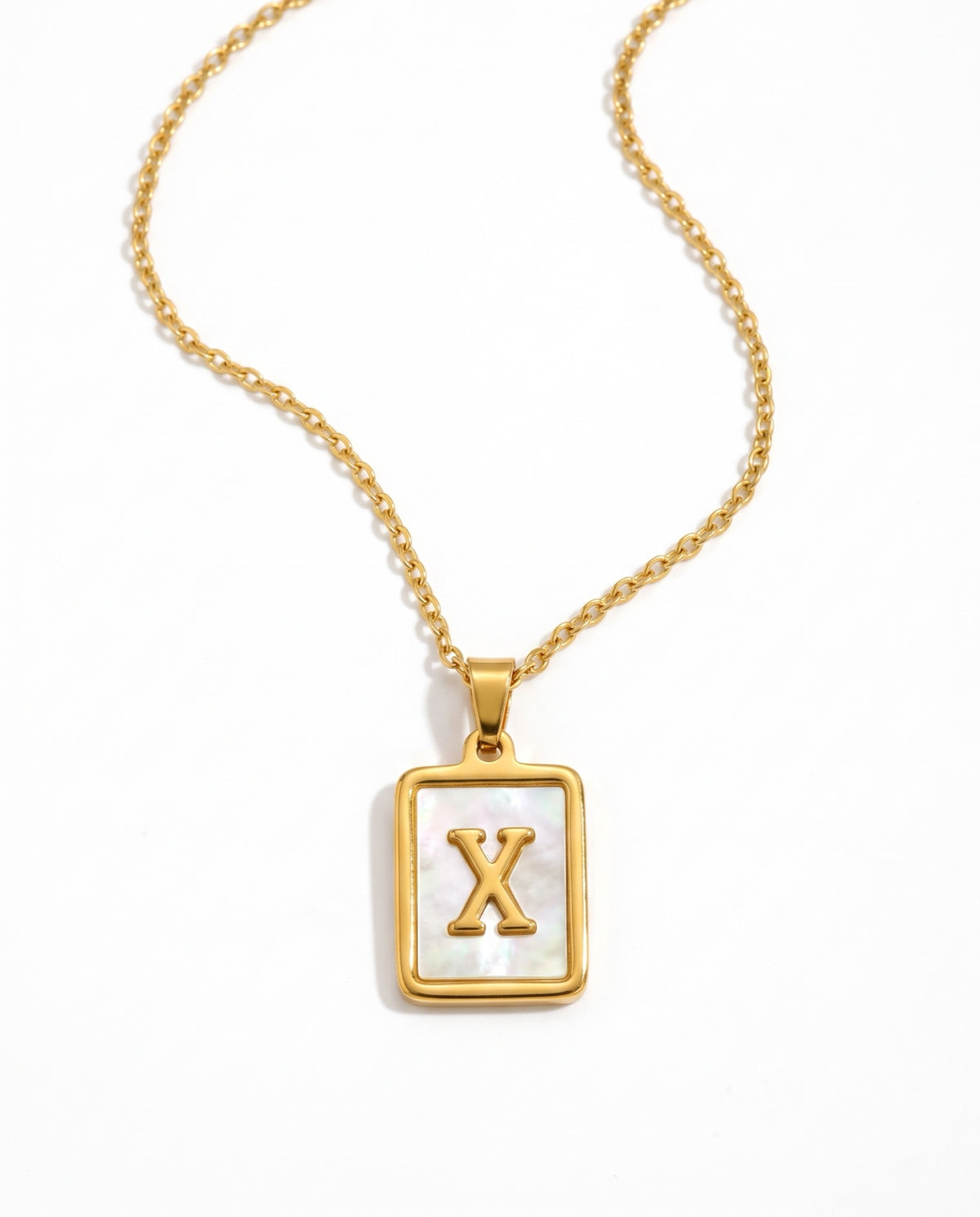 Dorado letra X
