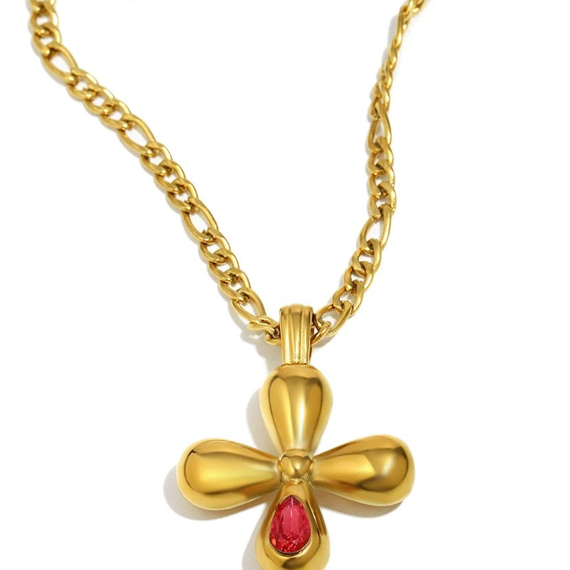 Cruz con piedra roja